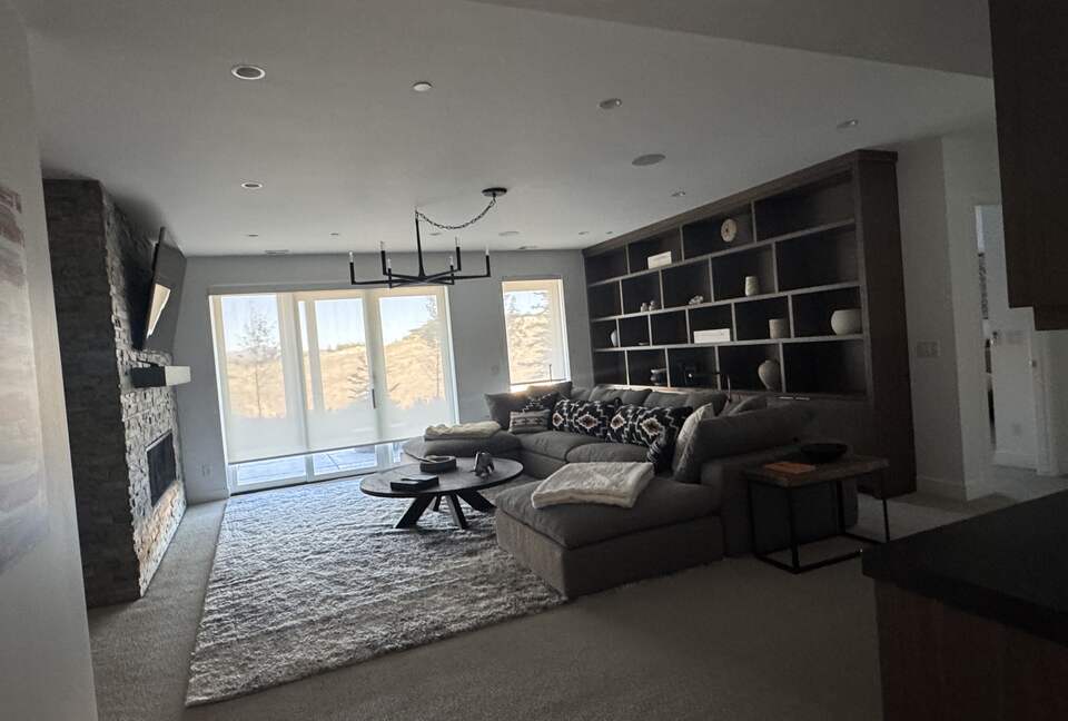 Lower level rec room with TV and comfy RH couch