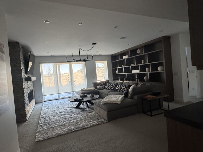 Lower level rec room with TV and comfy RH couch