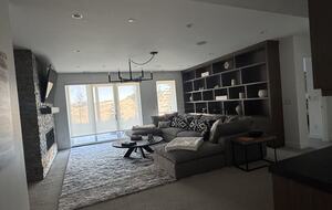 Lower level rec room with TV and comfy RH couch