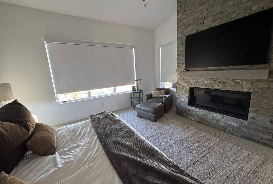 Master Bedroom, automated shades, fireplace, TV