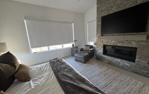 Master Bedroom, automated shades, fireplace, TV