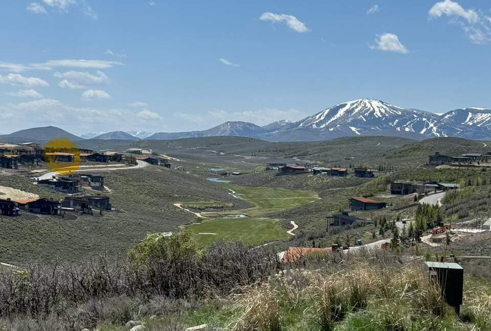 View from nearby, house in yellow on left