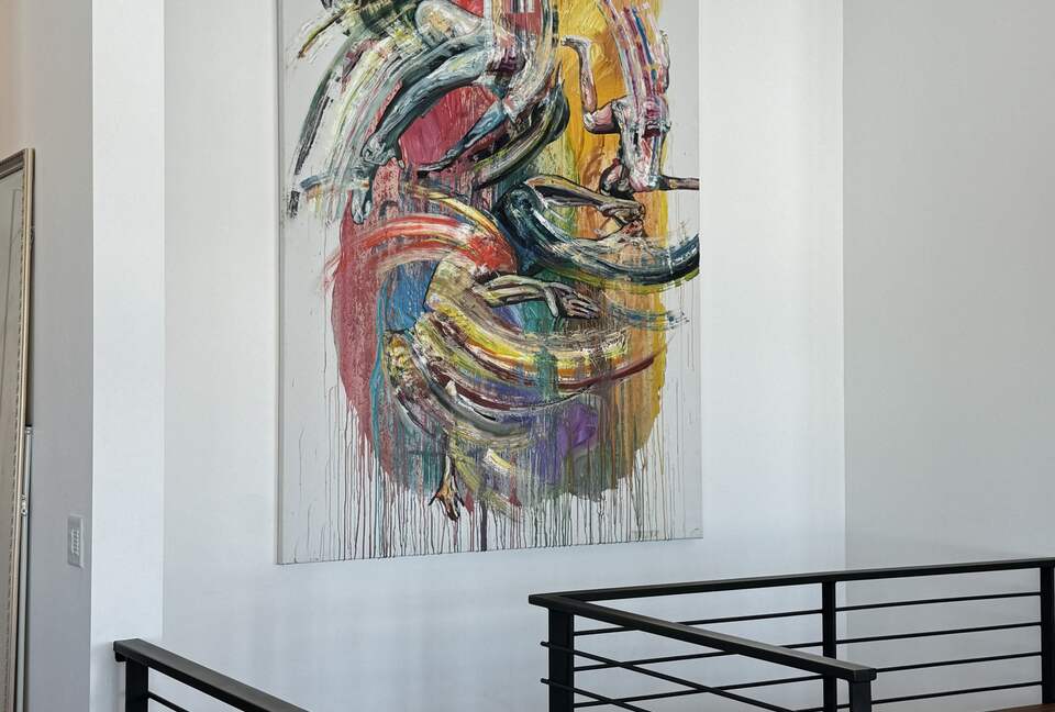 Staircase to lower level with 3 BR, Den, Gym, Office