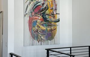 Staircase to lower level with 3 BR, Den, Gym, Office