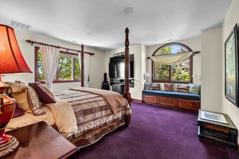 Bedroom attached to the library with king bed