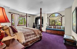 Bedroom attached to the library with king bed