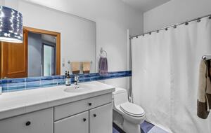 spare bathroom with tub and shower