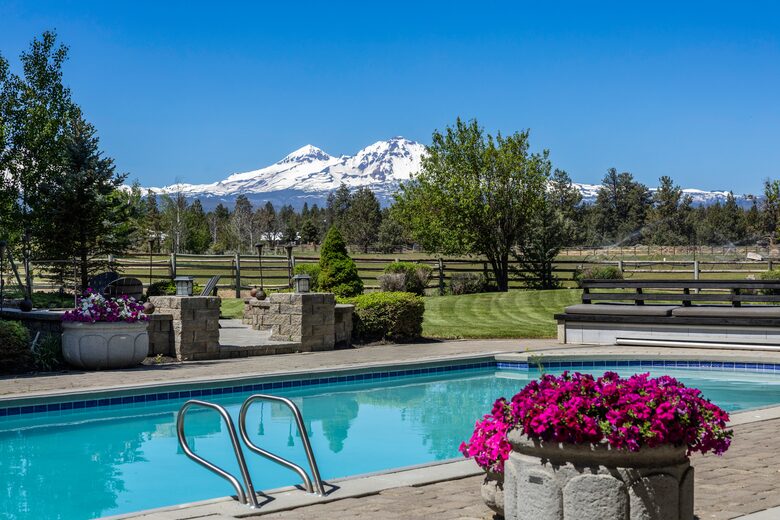 Heated pool with beautiful mountain, horse pasture views
