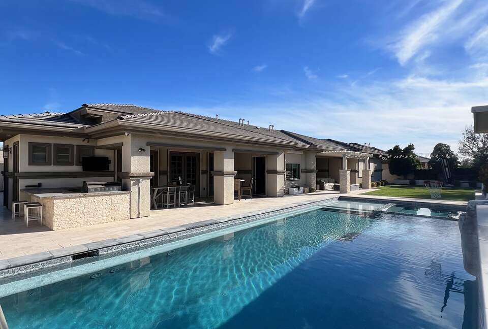 Resort style pool/BBQ with plenty of seating