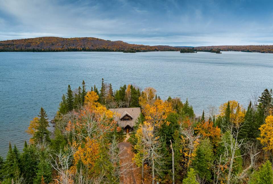 A cabin of stone and wood on a billion-years old rocky point