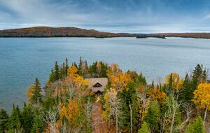A cabin of stone and wood on a billion-years old rocky point