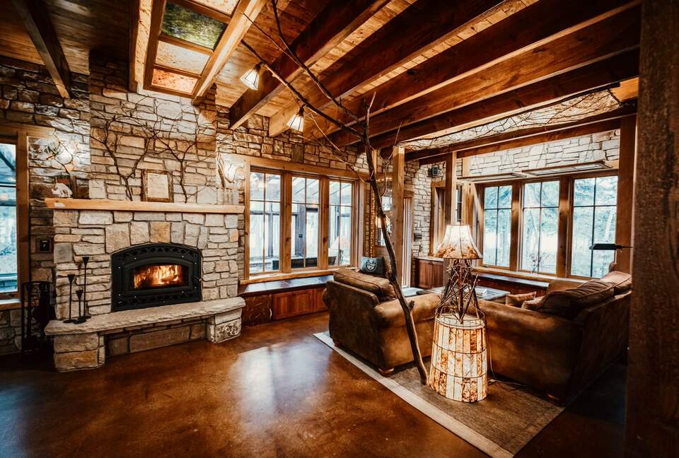 A wood-burning fireplace and dozens of home-made artsy lamps