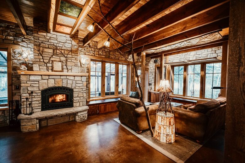 A wood-burning fireplace and dozens of home-made artsy lamps