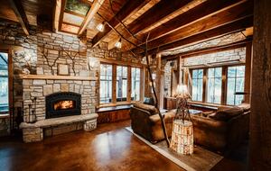 A wood-burning fireplace and dozens of home-made artsy lamps