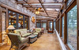 An enclosed porch for relaxing and enjoying the scenery