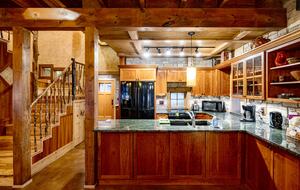 Kitchen with granite counters, cherry cabinetry and a view!