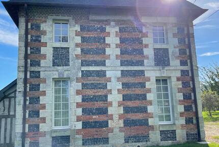 North side of the house with local flint, brick and chalk stone