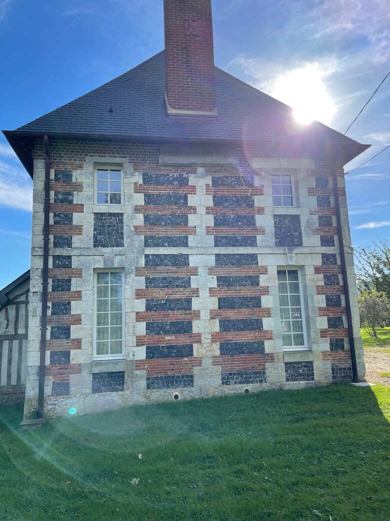 North side of the house with local flint, brick and chalk stone