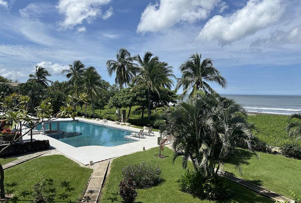 View from terrace to pool and beach