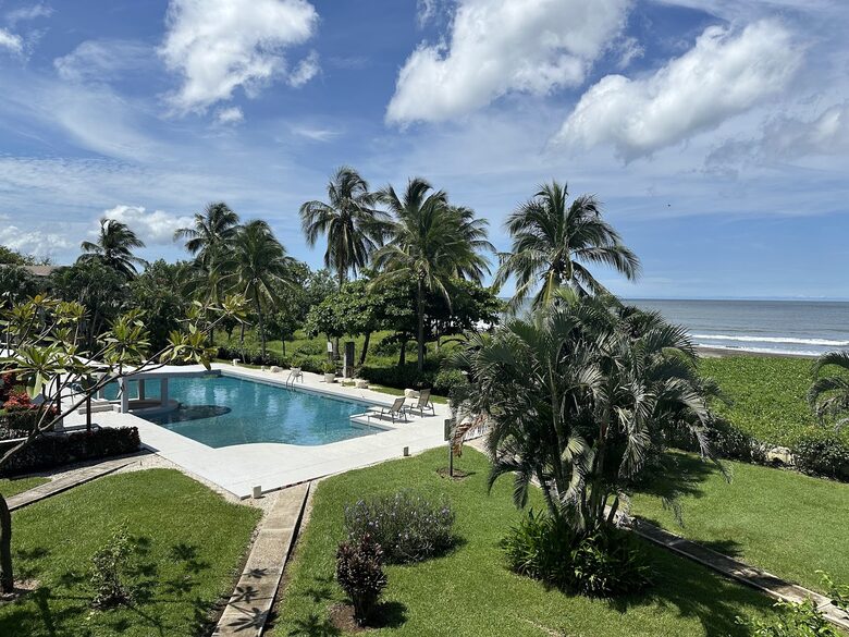 View from terrace to pool and beach