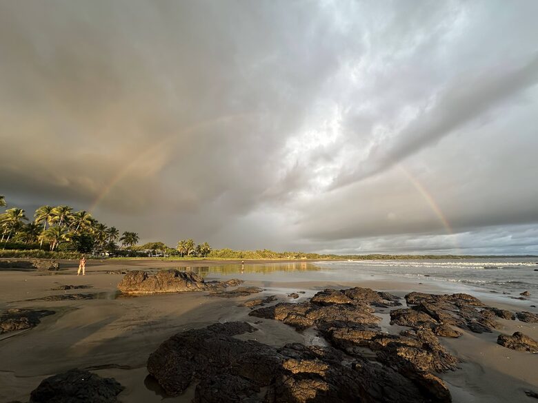 The beach view South with a rainbow