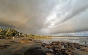 The beach view South with a rainbow