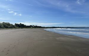 The beach in front of the property, looking South