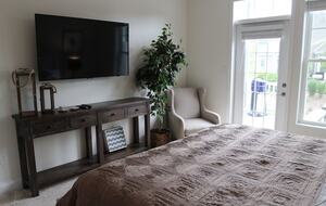 Main floor primary bdrm, tv, walkin closet, deck access, king bed