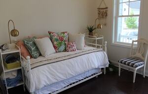Main floor bedroom with two twin trundle bed, access to front porch