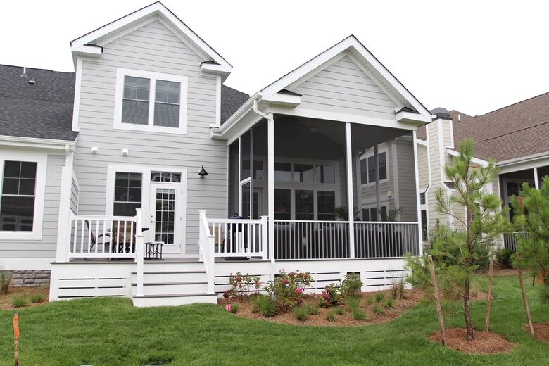 View of back of house with screened in porch and deck, gas grill