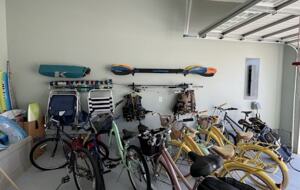 Tons of bikes and beach stuff, foosball, mini fridge, EV charger,