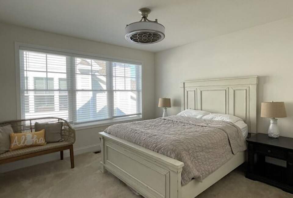 Queen bed with ceiling fan, large closet