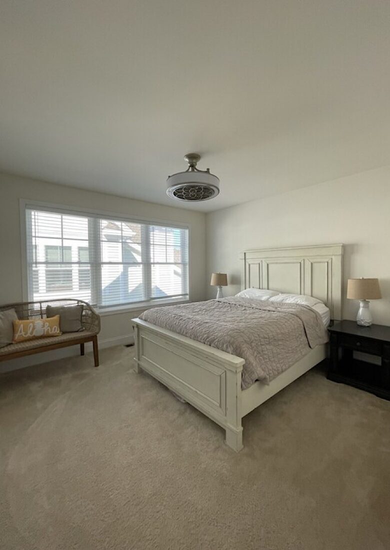 Queen bed with ceiling fan, large closet