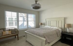 Queen bed with ceiling fan, large closet