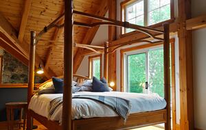 Primary Suite with lake views and private balcony