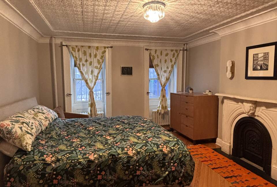 King bedroom with fireplace en suite bathroom 3 closets