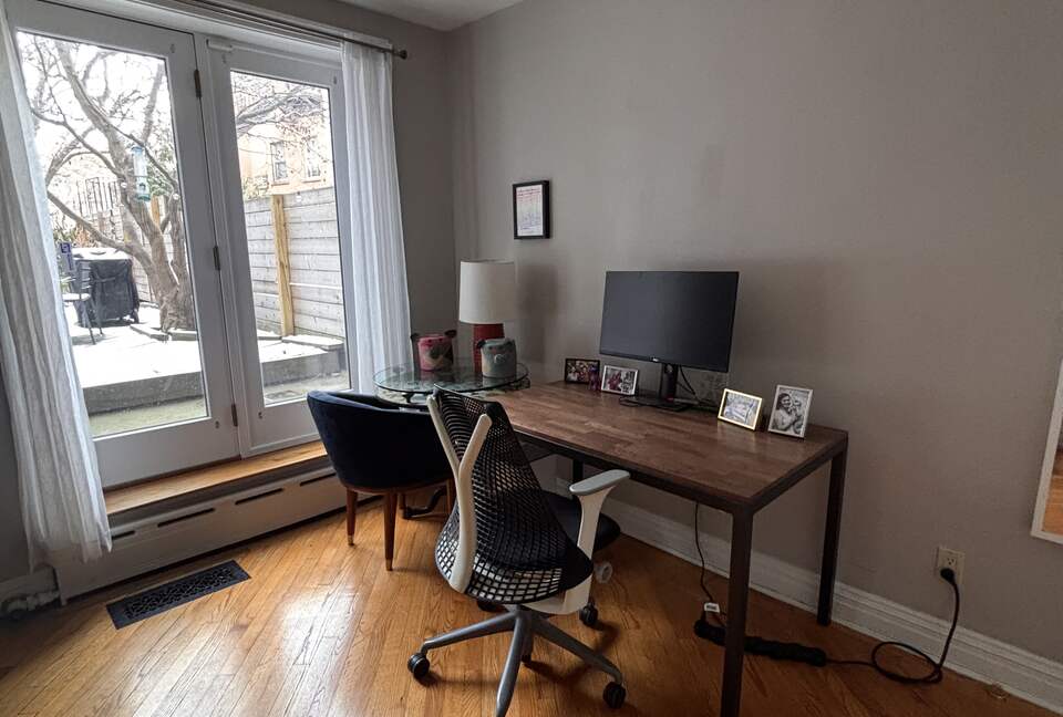 Home office and workout room with backyard access