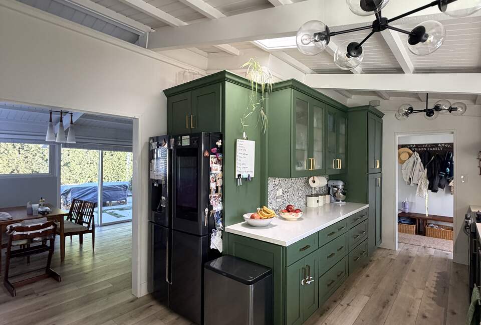 Kitchen view with Skylight and Refrigerator.