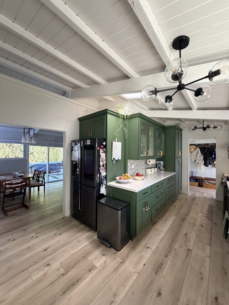 Kitchen view with Skylight and Refrigerator.