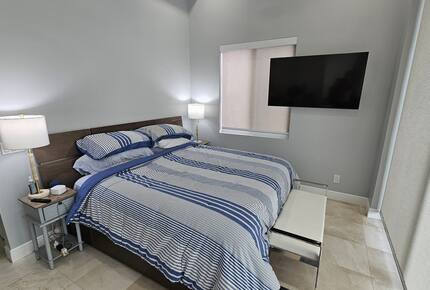 Master BR downstairs with 10 ft floor to ceiling glass