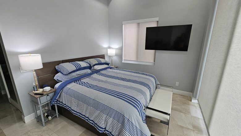 Master BR downstairs with 10 ft floor to ceiling glass