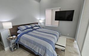 Master BR downstairs with 10 ft floor to ceiling glass