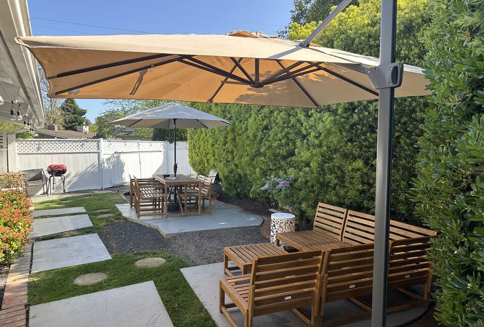 Backyard view of Couch and Table. Both underlit and cushions