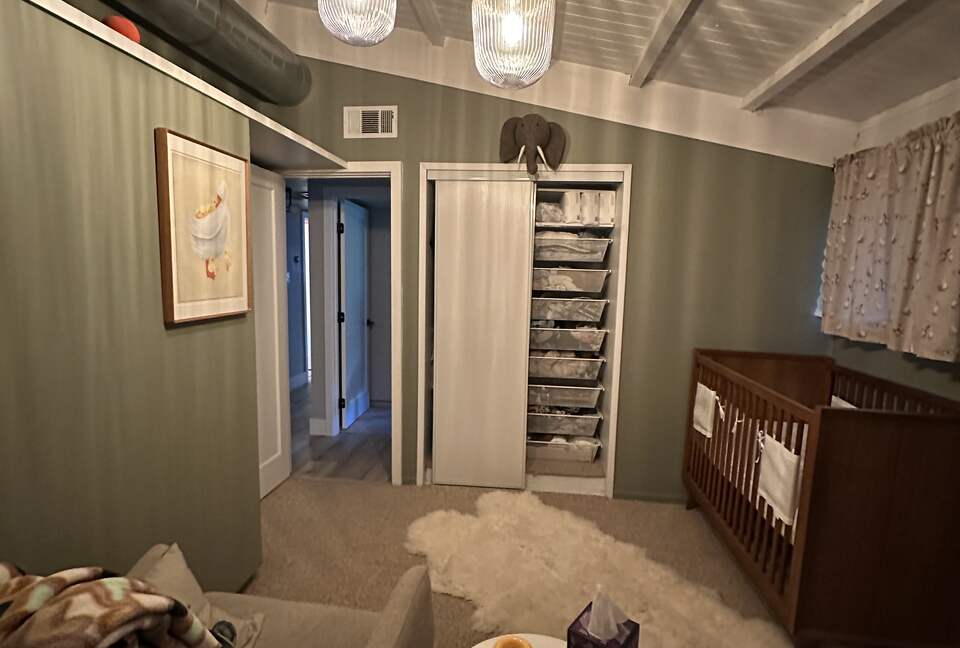 Nursery with Crib, Rocker, and Changing Table