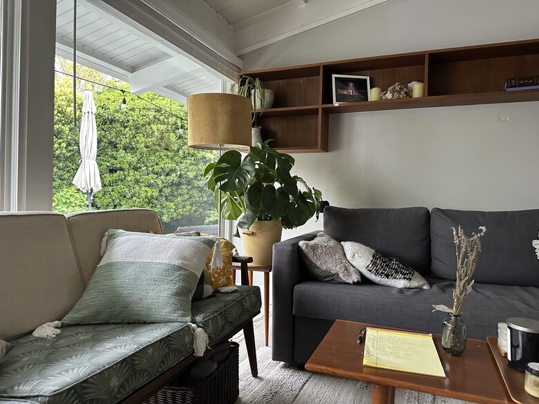 Livingroom with double couches. One pulls out to a queen bed