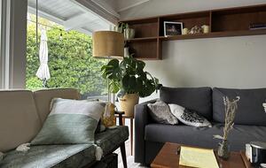 Livingroom with double couches. One pulls out to a queen bed