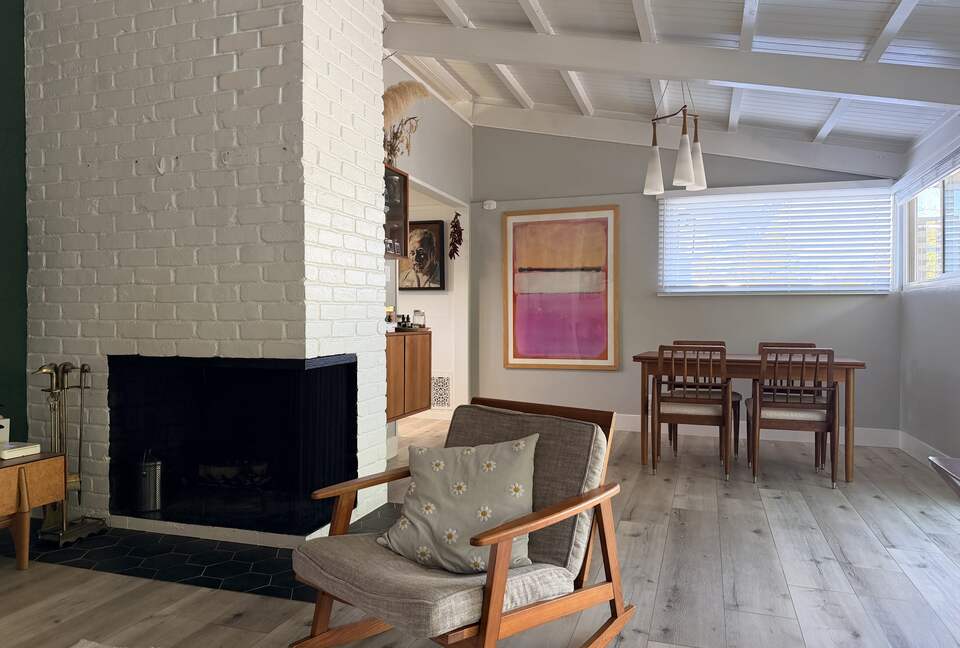 View of Dining area from living room. Working Fireplace.
