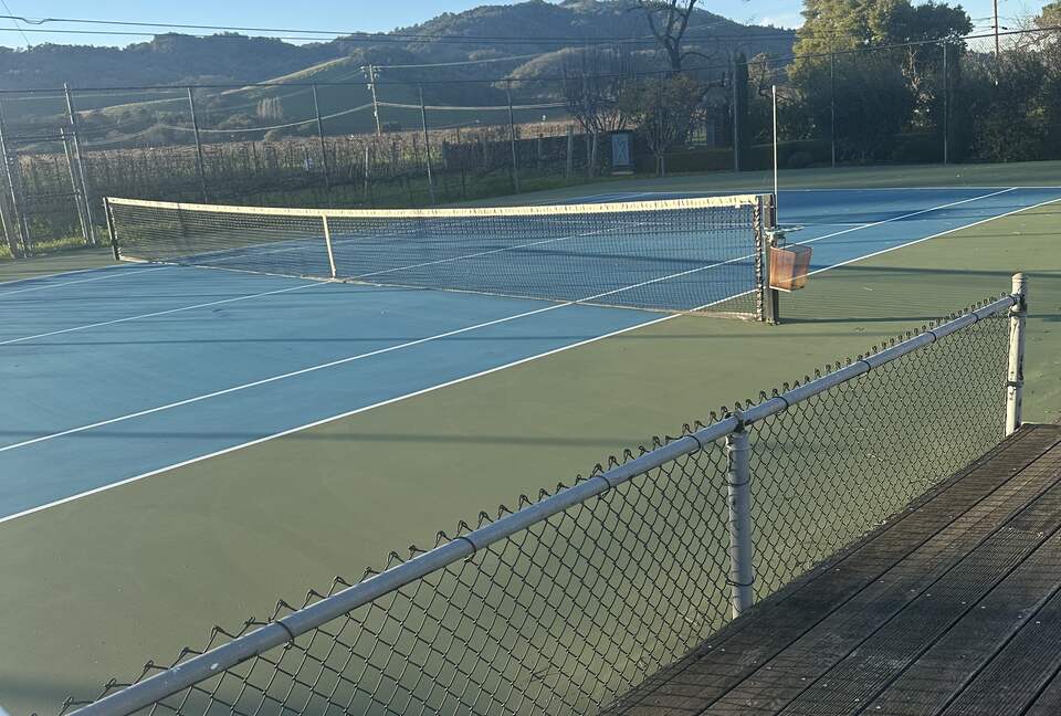 Tennis Court with rackets and balls