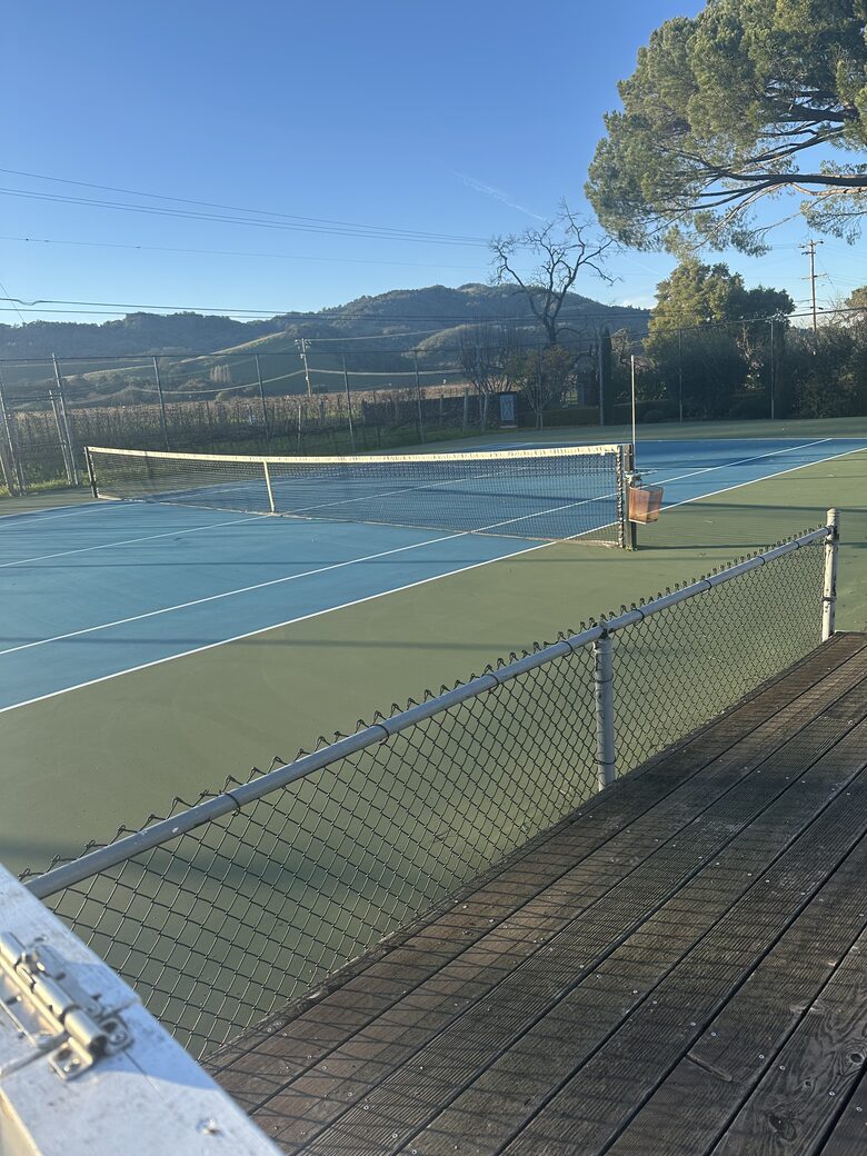 Tennis Court with rackets and balls