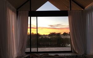 Master bedroom sunrise view from bed
